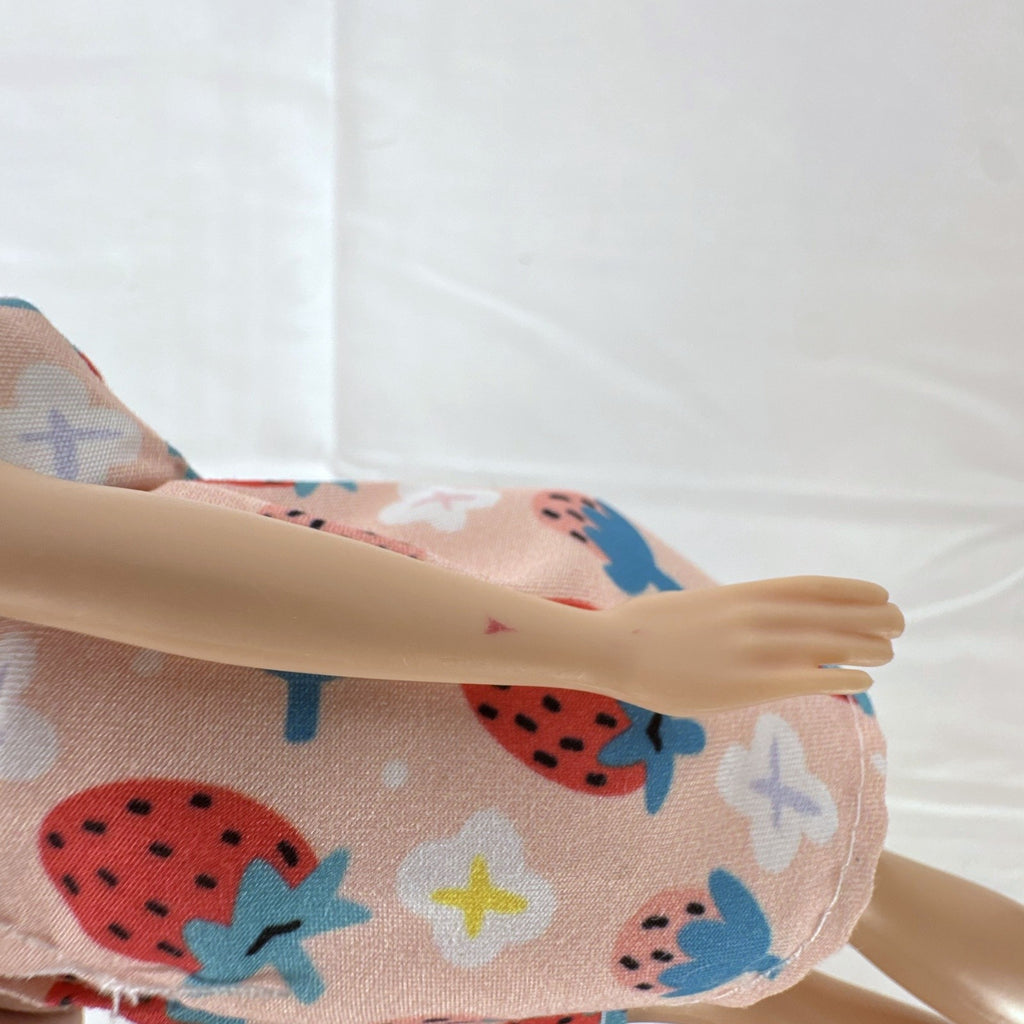 Hasbro Disney Princess Belle 11-inch fashion doll wearing a strawberry print dress