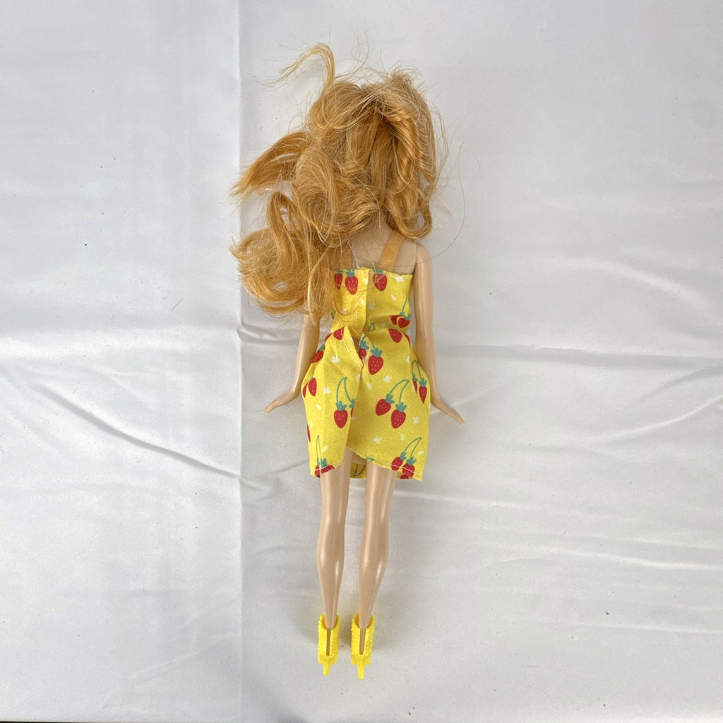 Mattel Disney Frozen Princess Anna 11-inch fashion doll wearing yellow strawberry dress and ankle booties