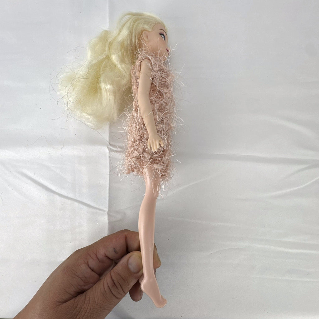 Disney Frozen Elsa 11-inch fashion doll wearing a fuzzy pink knit dress