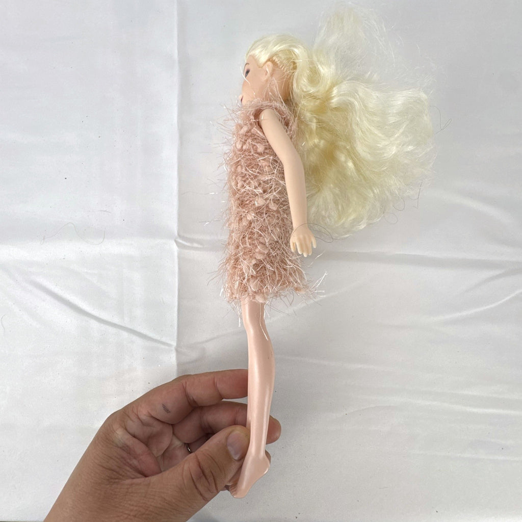 Disney Frozen Elsa 11-inch fashion doll wearing a fuzzy pink knit dress