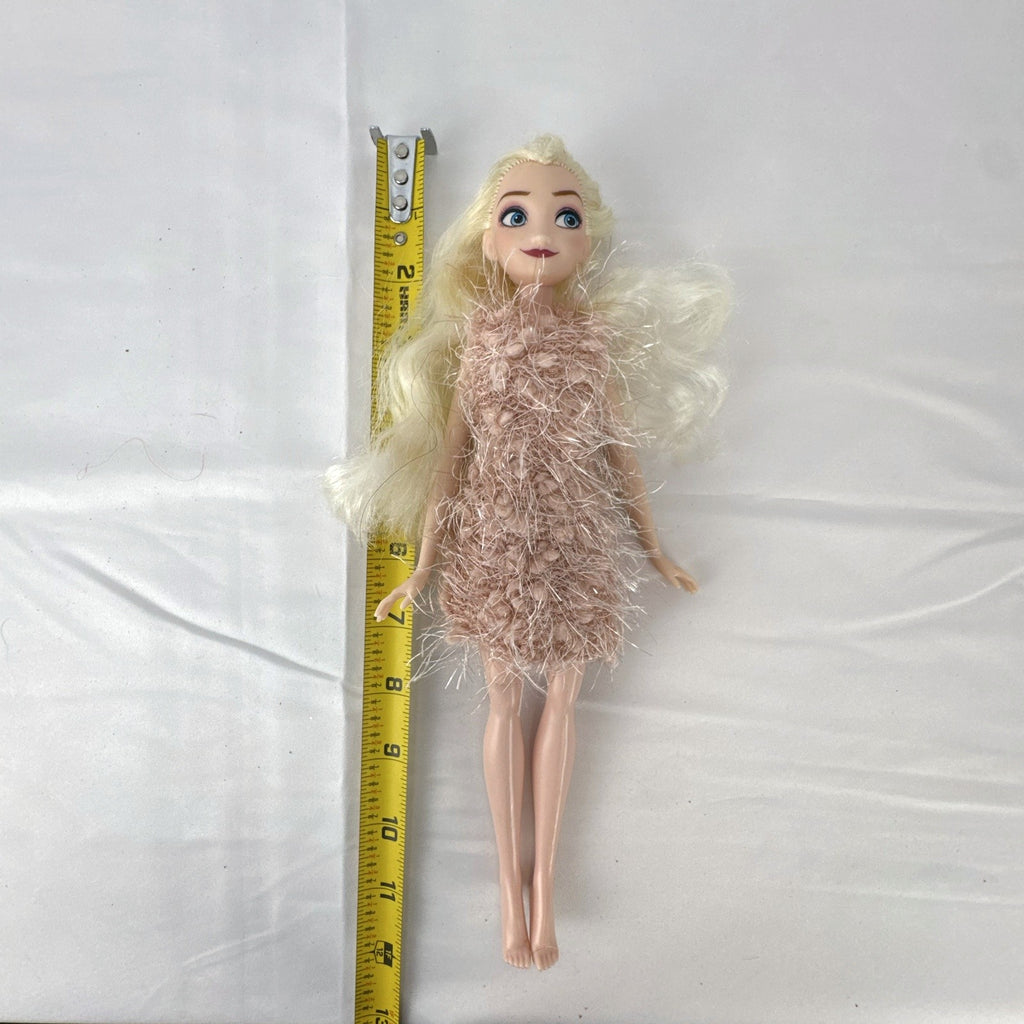Disney Frozen Elsa 11-inch fashion doll wearing a fuzzy pink knit dress