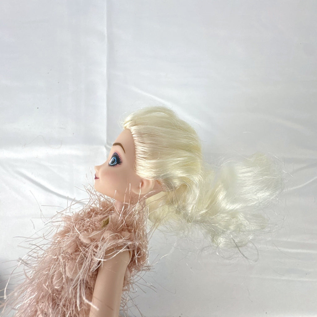 Disney Frozen Elsa 11-inch fashion doll wearing a fuzzy pink knit dress
