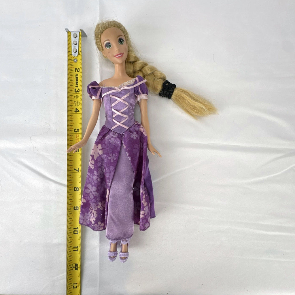 Mattel Disney Princess Rapunzel 11-inch doll wearing purple floral dress and shoes with braided blonde hair