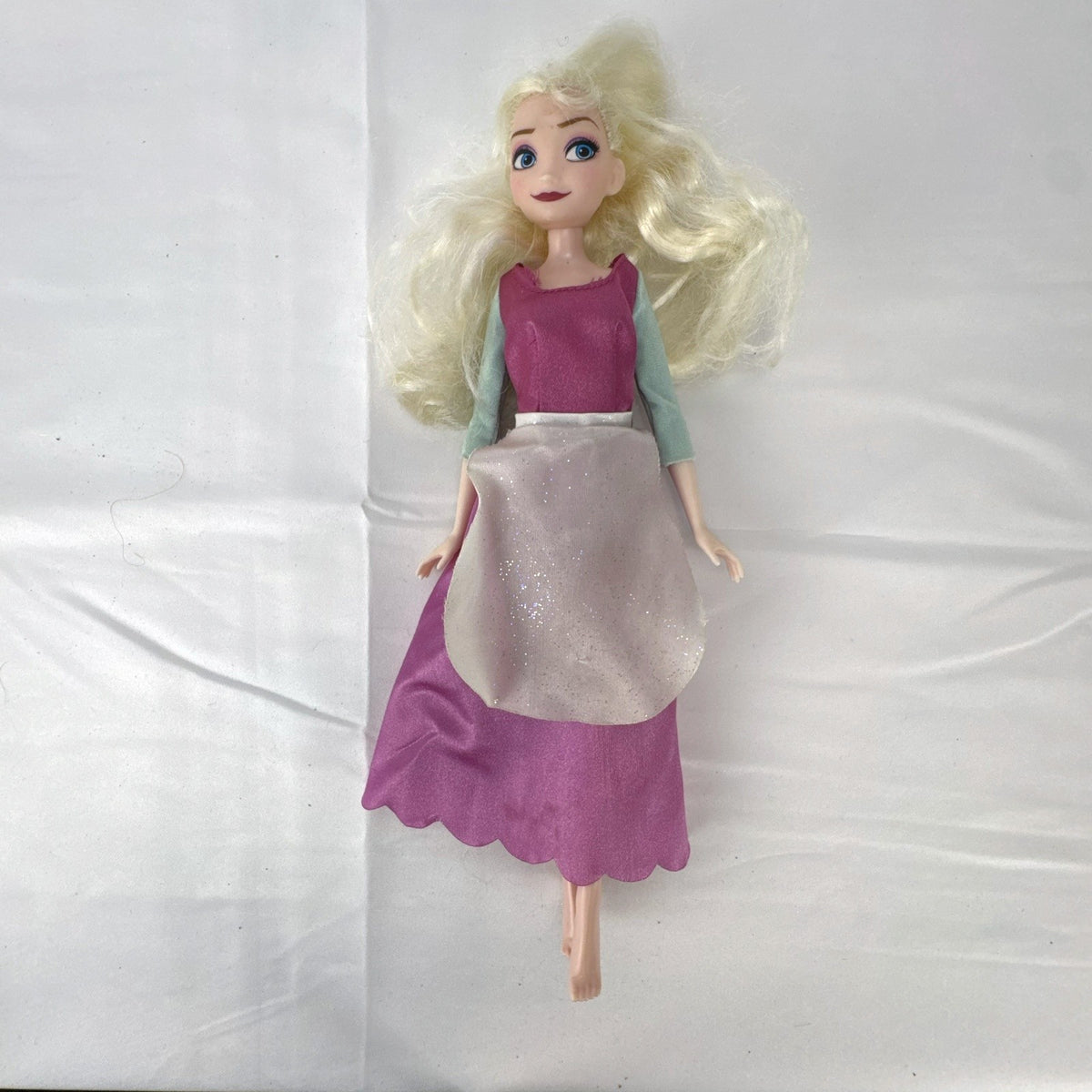 Disney Frozen 11-inch Elsa fashion doll wearing pink peasant dress with shimmering apron