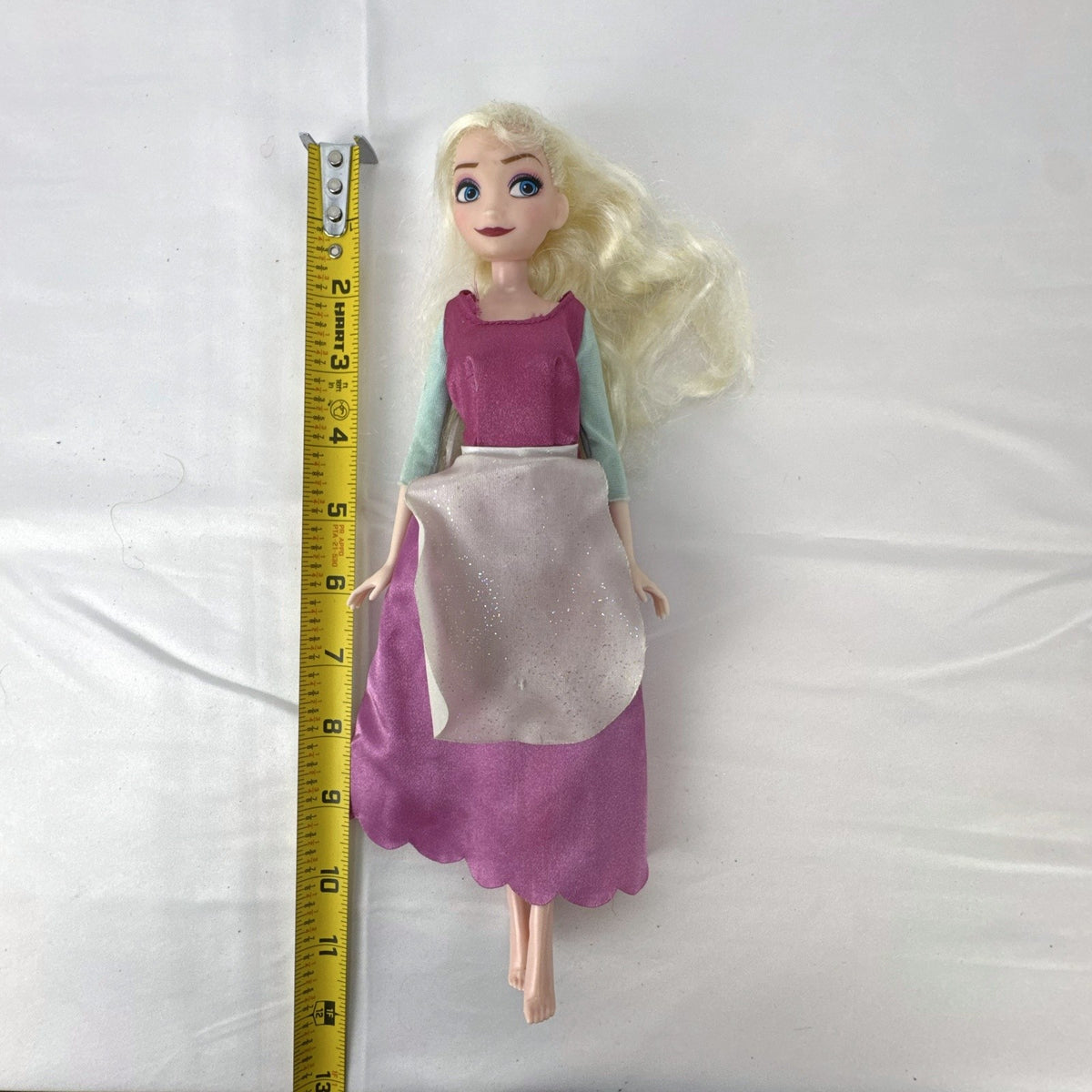 Disney Frozen 11-inch Elsa fashion doll wearing pink peasant dress with shimmering apron