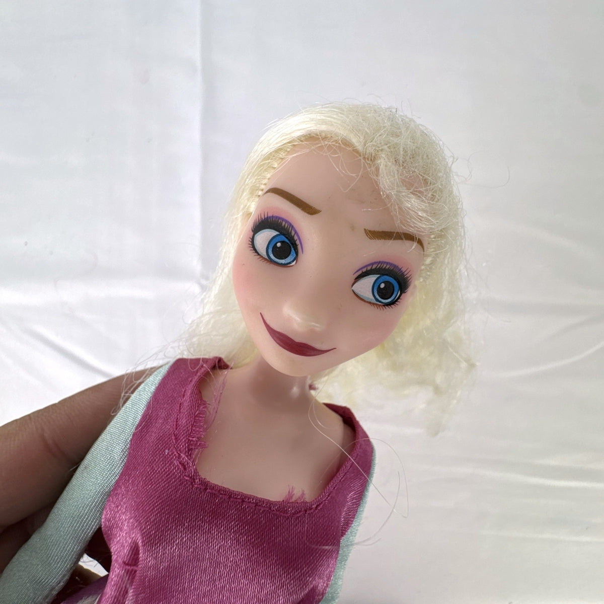 Disney Frozen 11-inch Elsa fashion doll wearing pink peasant dress with shimmering apron