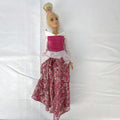 12-inch Mattel Barbie fashion doll wearing a pink Disney Princess Aurora Sleeping Beauty dress with blonde hair in a topknot