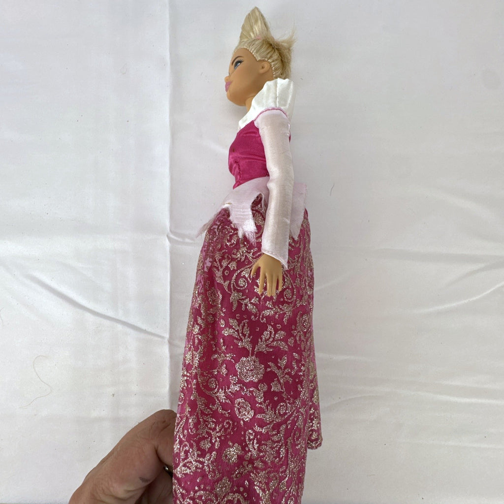 12-inch Mattel Barbie fashion doll wearing a pink Disney Princess Aurora Sleeping Beauty dress with blonde hair in a topknot