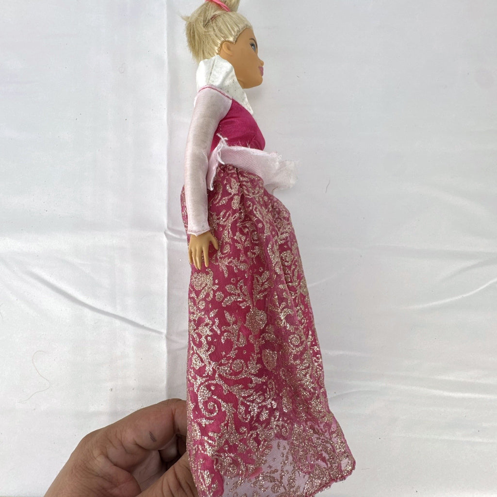 12-inch Mattel Barbie fashion doll wearing a pink Disney Princess Aurora Sleeping Beauty dress with blonde hair in a topknot