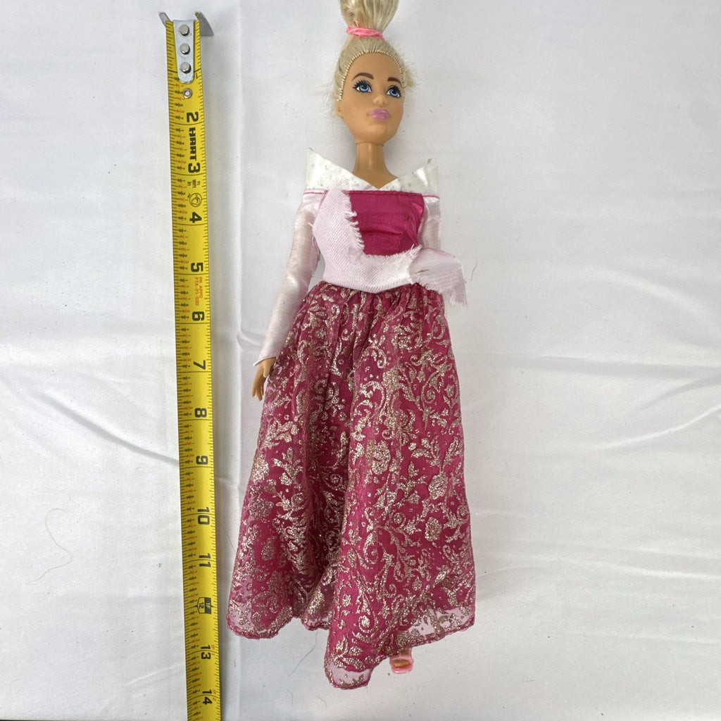 12-inch Mattel Barbie fashion doll wearing a pink Disney Princess Aurora Sleeping Beauty dress with blonde hair in a topknot