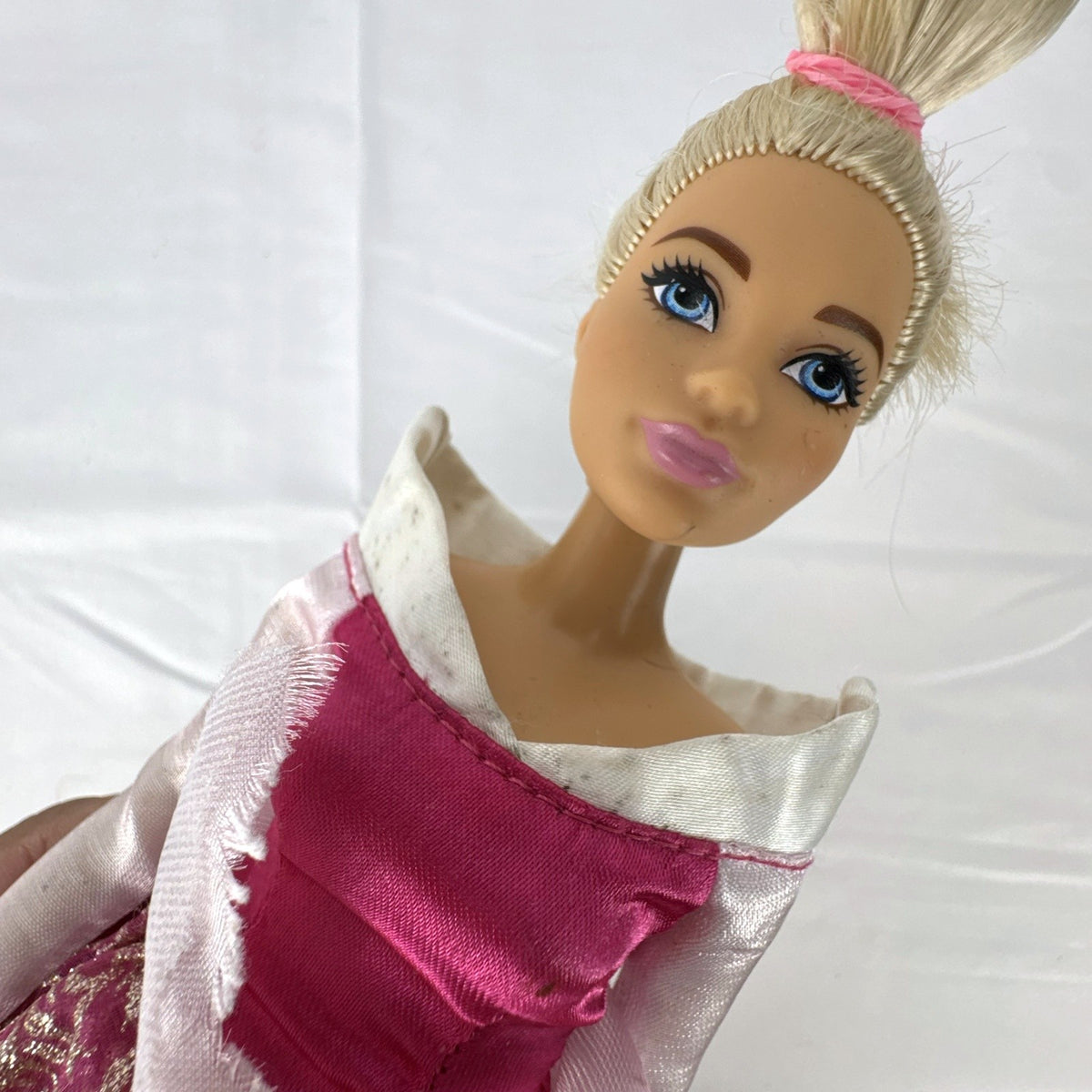 12-inch Mattel Barbie fashion doll wearing a pink Disney Princess Aurora Sleeping Beauty dress with blonde hair in a topknot