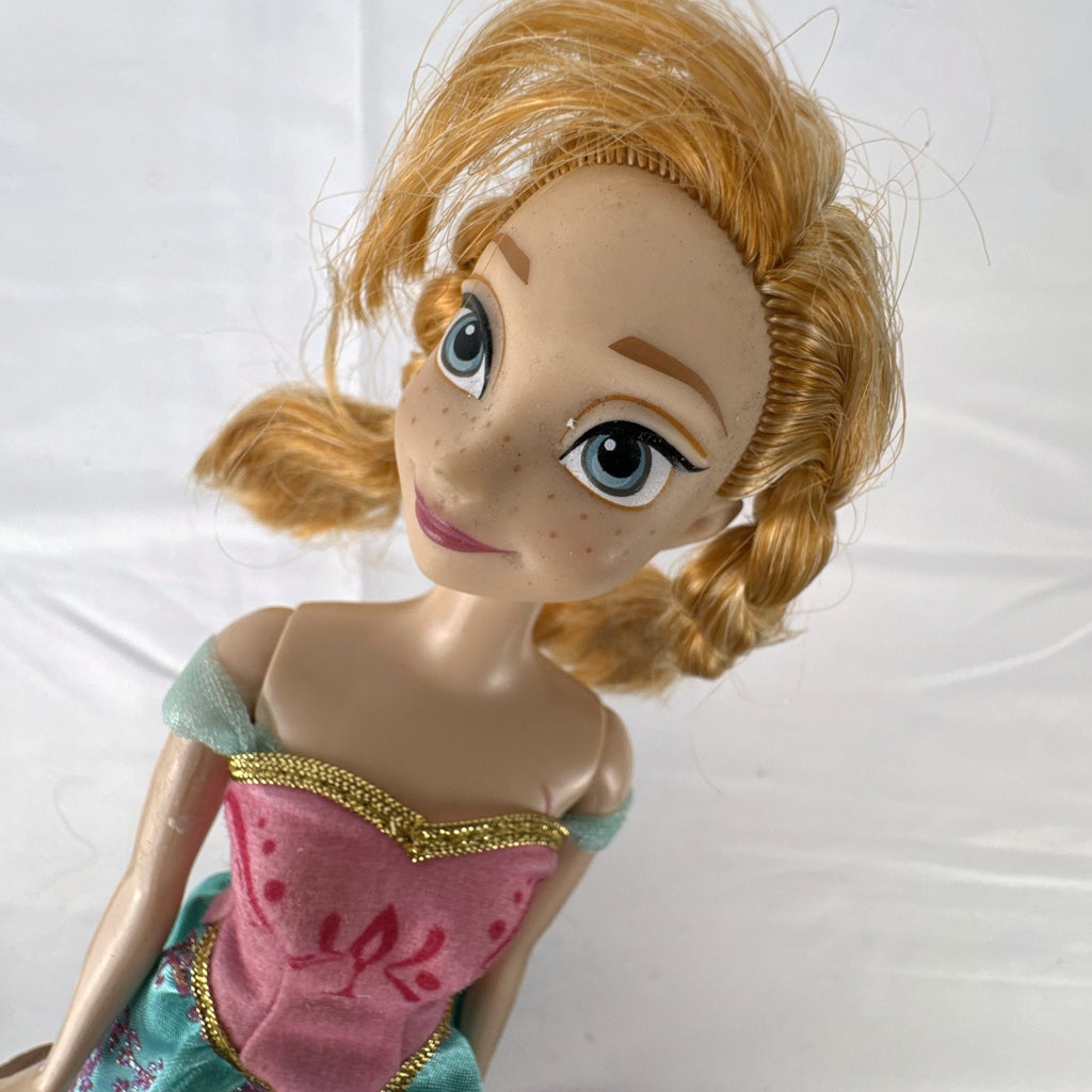 Mattel Disney Frozen 11-inch Princess Anna doll in pink and teal glitter dress with braided hair