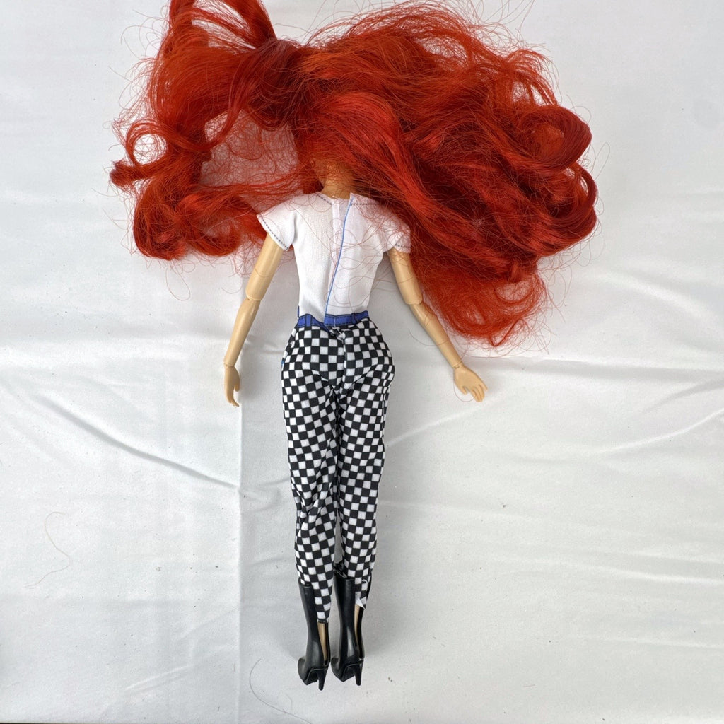 Articulated 11-inch Disney Ariel fashion doll with red hair in casual checkered pants and graphic t-shirt
