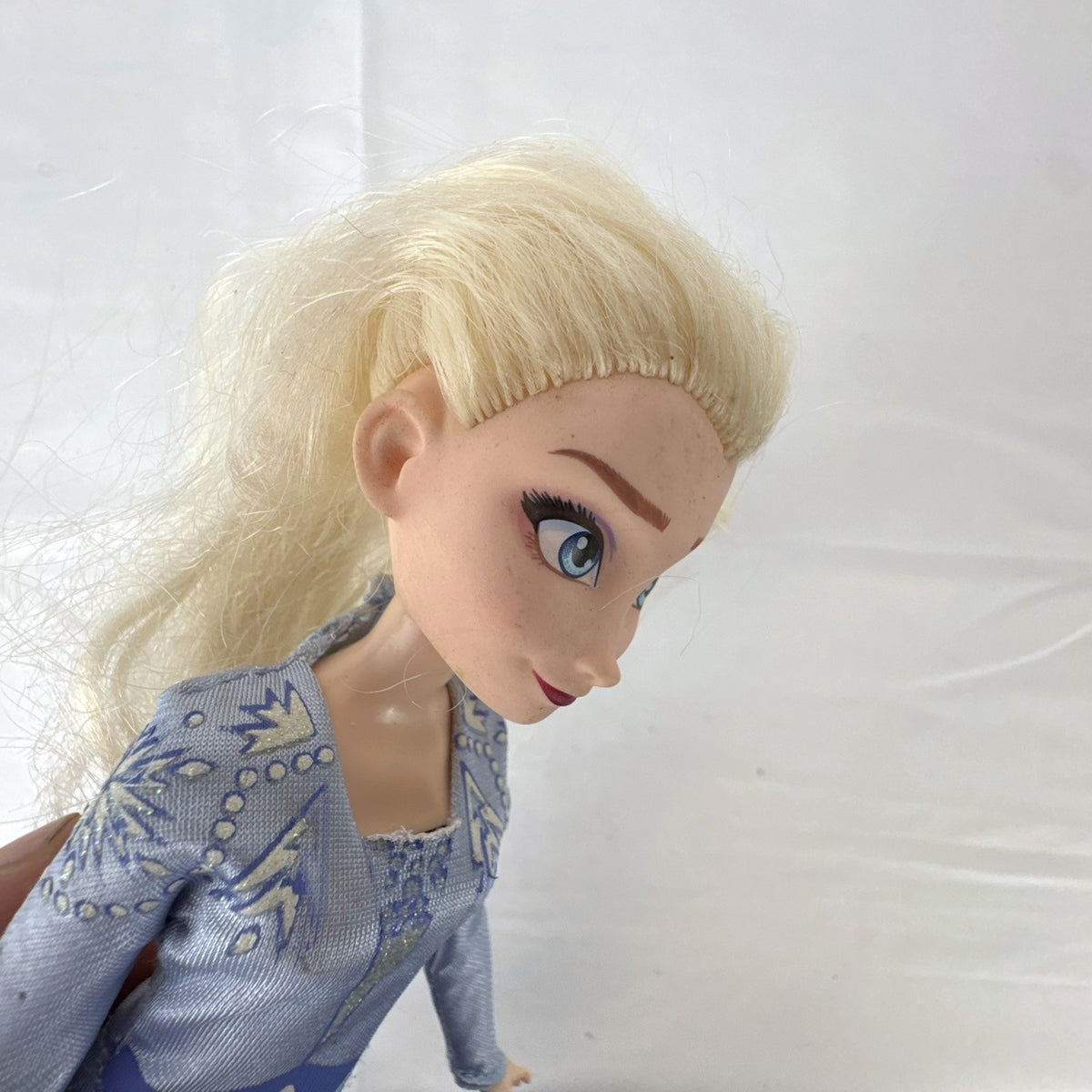 Hasbro Disney Frozen 2 Elsa 11-inch fashion doll wearing blue patterned travel dress and boots