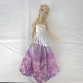 Mattel Disney Frozen Elsa 11-inch fashion doll with blonde braid in purple floral dress and heels