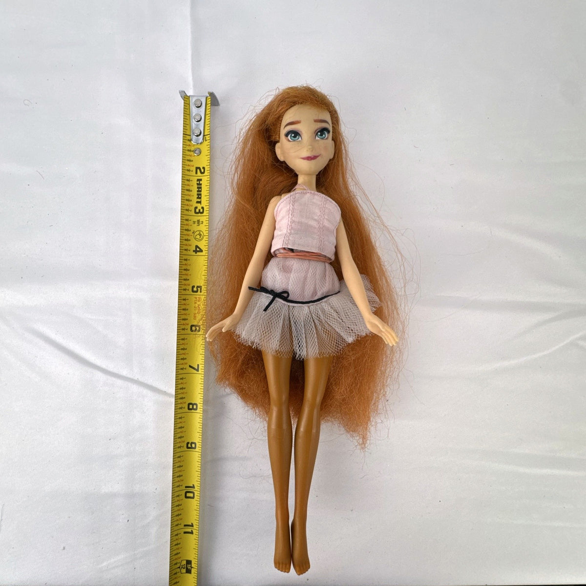 Disney Frozen 11-inch Anna fashion doll with auburn hair in a pink ballerina tutu
