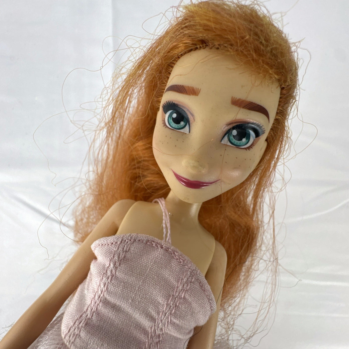 Disney Frozen 11-inch Anna fashion doll with auburn hair in a pink ballerina tutu