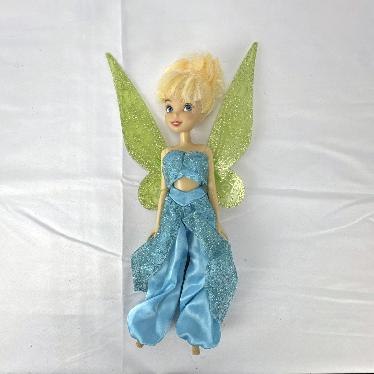 Disney Fairies Tinker Bell 10-inch doll wearing shimmering blue outfit with translucent green glitter wings