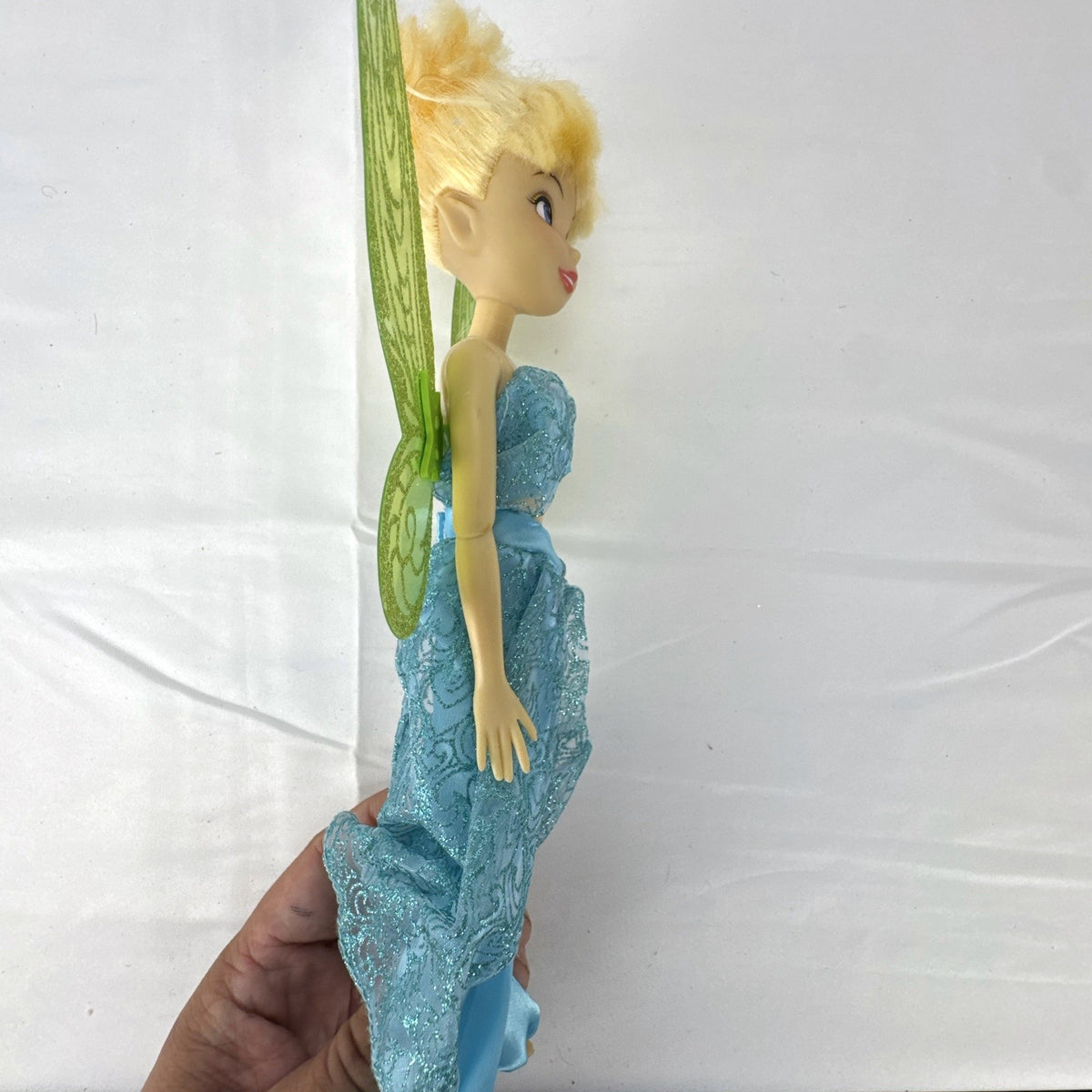 Disney Fairies Tinker Bell 10-inch doll wearing shimmering blue outfit with translucent green glitter wings