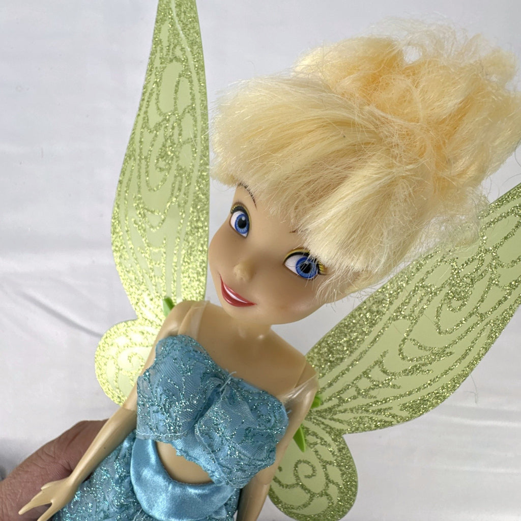 Disney Fairies Tinker Bell 10-inch doll wearing shimmering blue outfit with translucent green glitter wings