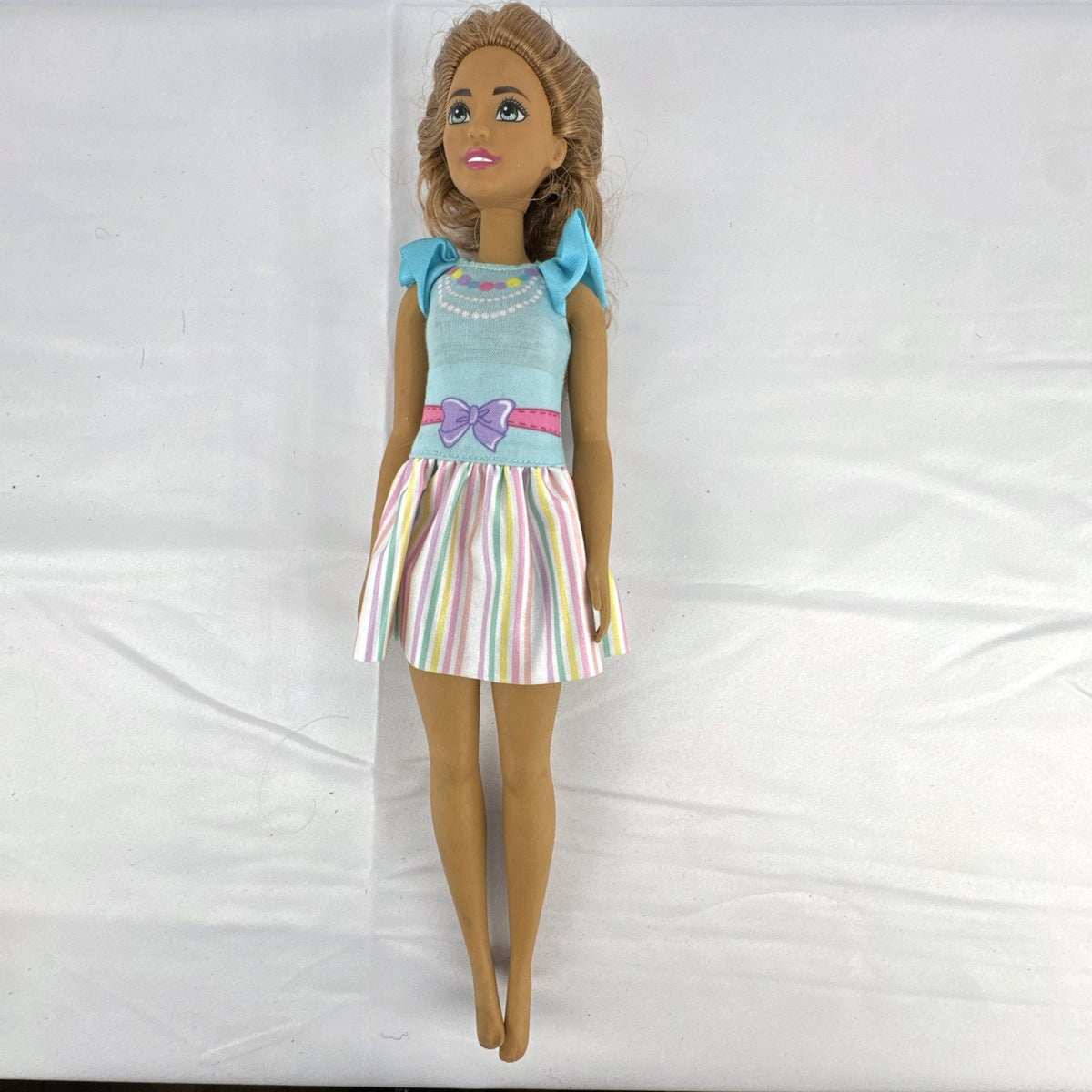 Mattel My First Barbie Teresa 14.5-inch preschool doll wearing a pastel striped ruffle dress