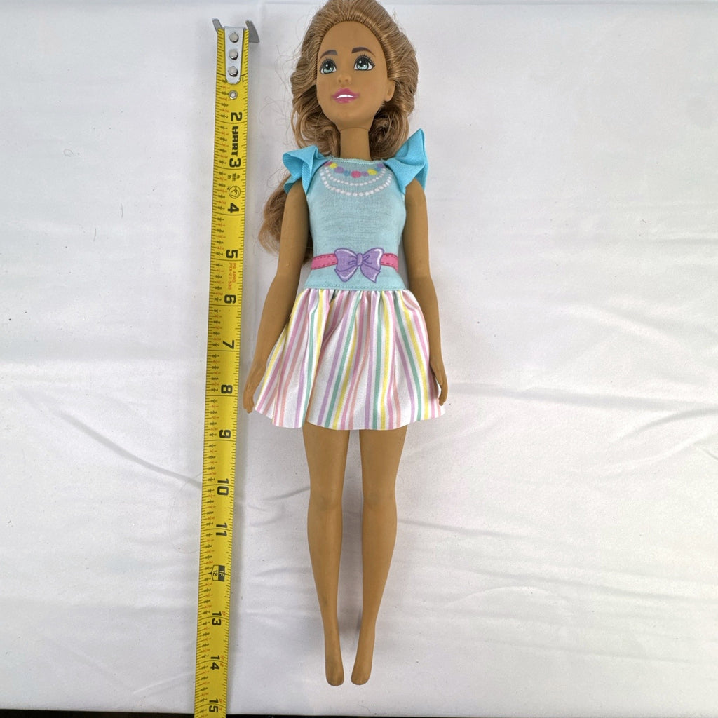 Mattel My First Barbie Teresa 14.5-inch preschool doll wearing a pastel striped ruffle dress
