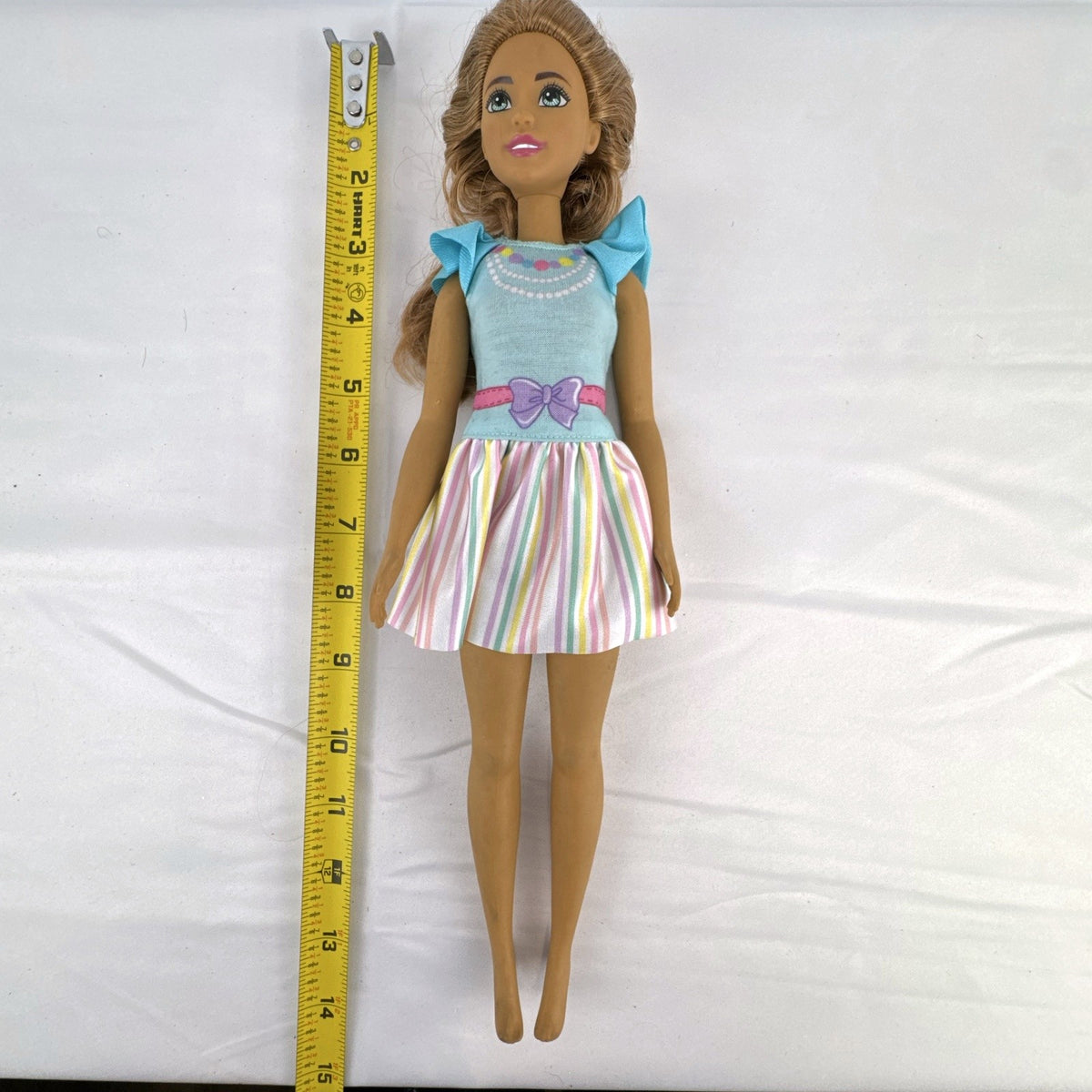 Mattel My First Barbie Teresa 14.5-inch preschool doll wearing a pastel striped ruffle dress