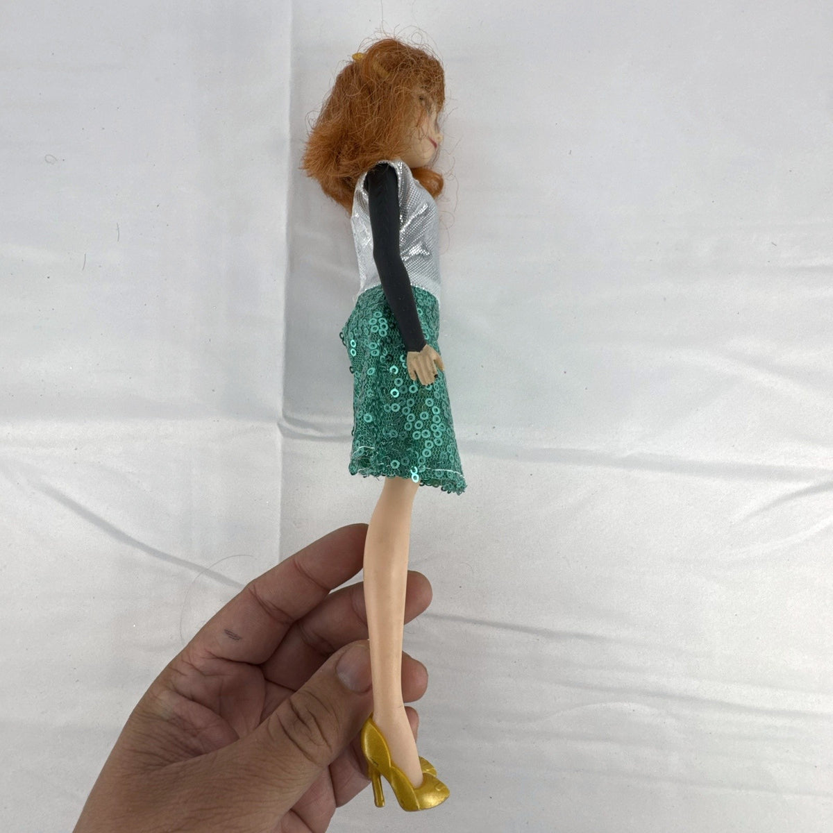 Hasbro Disney Frozen Style Series 11-inch Anna doll wearing a sequin dress and gold heels