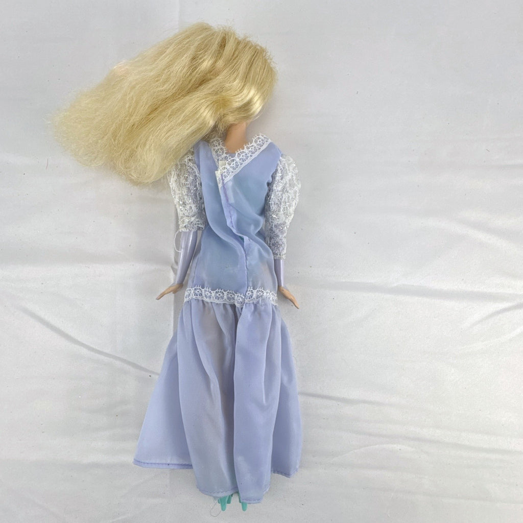 Mattel Disney Frozen Elsa 11-inch fashion doll wearing a purple lace gown and teal shoes.