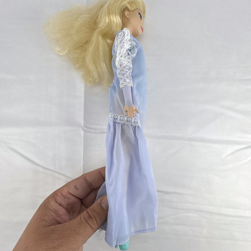 Mattel Disney Frozen Elsa 11-inch fashion doll wearing a purple lace gown and teal shoes.