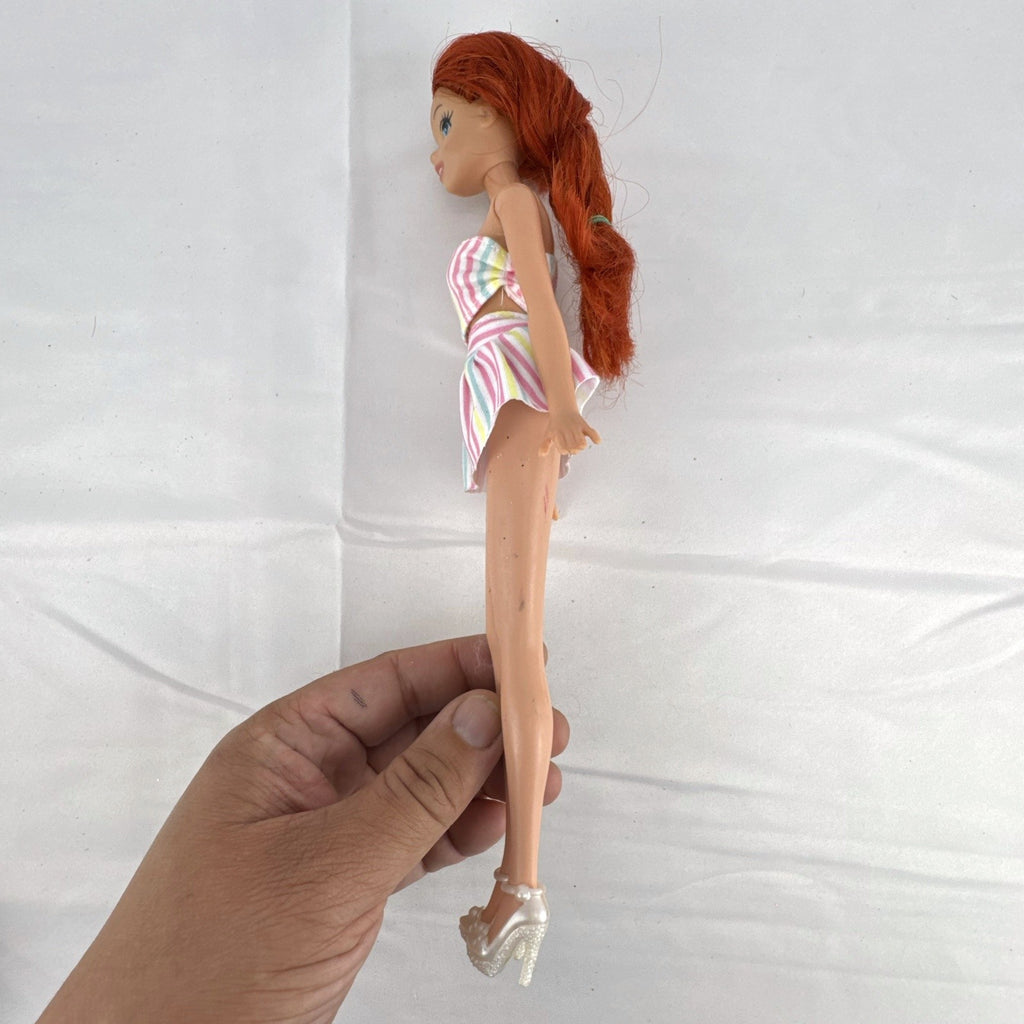 Mattel 2005 Disney Princess Ariel 11-inch fashion doll with red hair in a pastel striped outfit and pearlized heels.