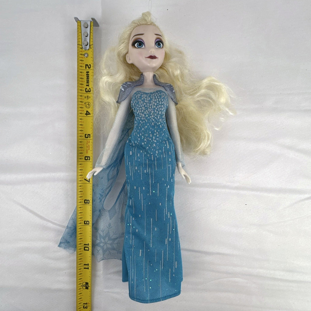 Disney Store Frozen Elsa classic fashion doll wearing sparkling blue gown with sheer cape
