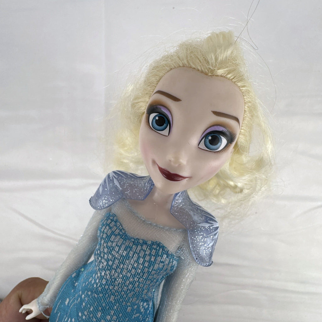 Disney Store Frozen Elsa classic fashion doll wearing sparkling blue gown with sheer cape