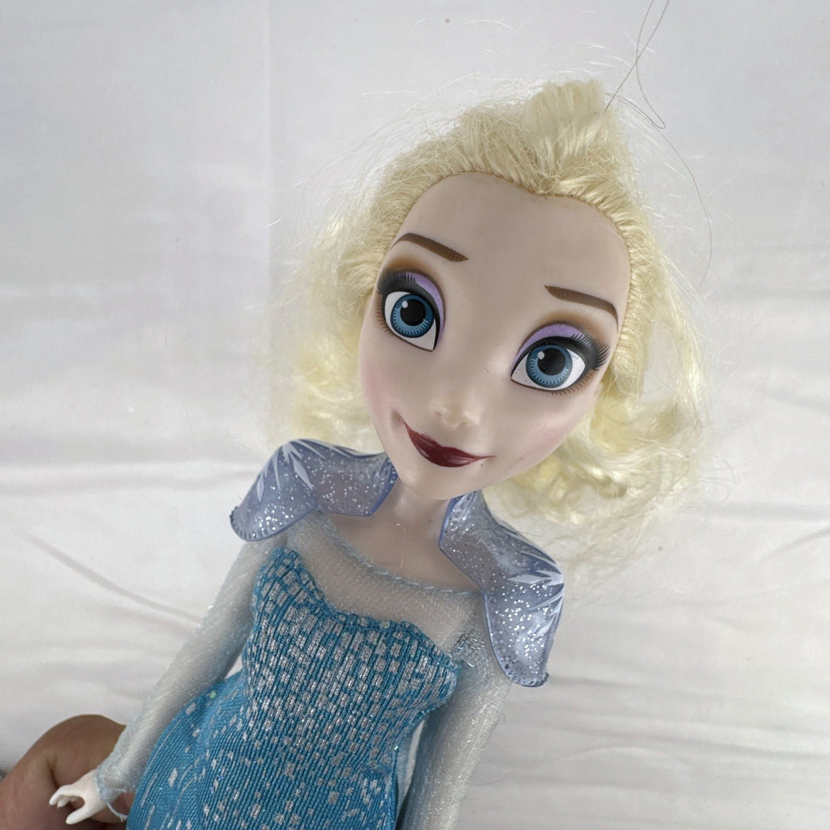 Disney Store Frozen Elsa classic fashion doll wearing sparkling blue gown with sheer cape