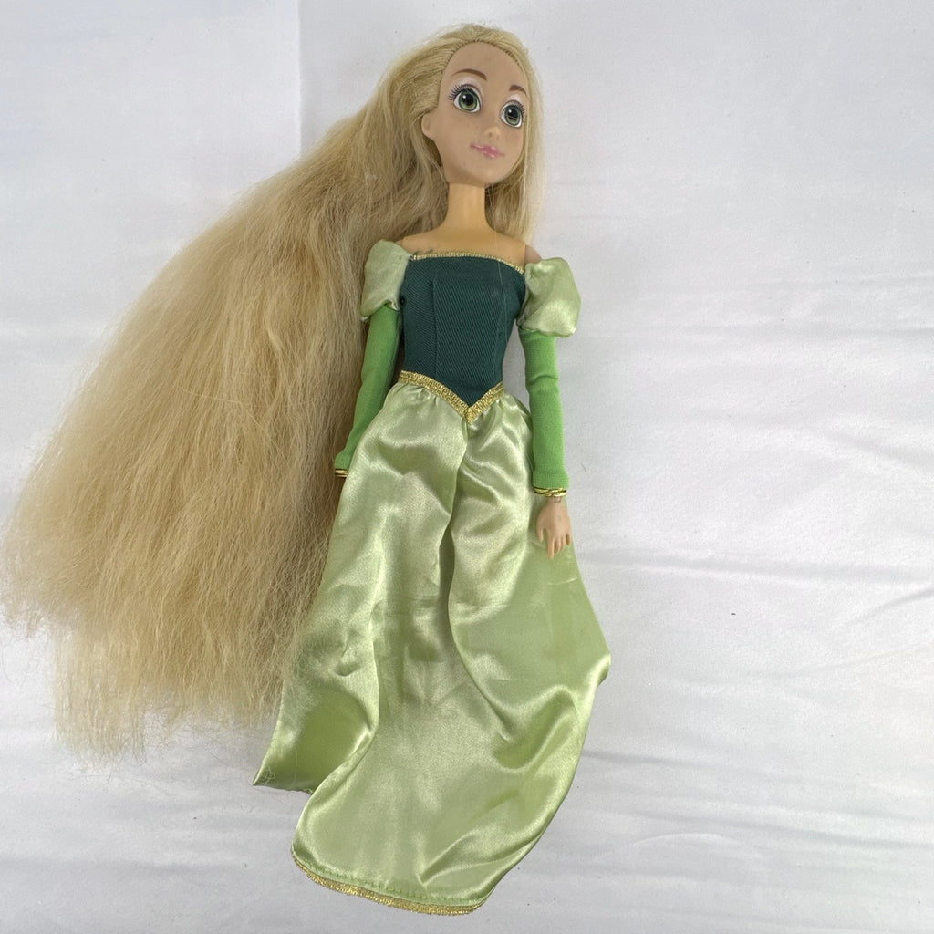 Disney Princess Rapunzel 12-inch fashion doll wearing a two-tone green gown with gold trim and grey shoes.