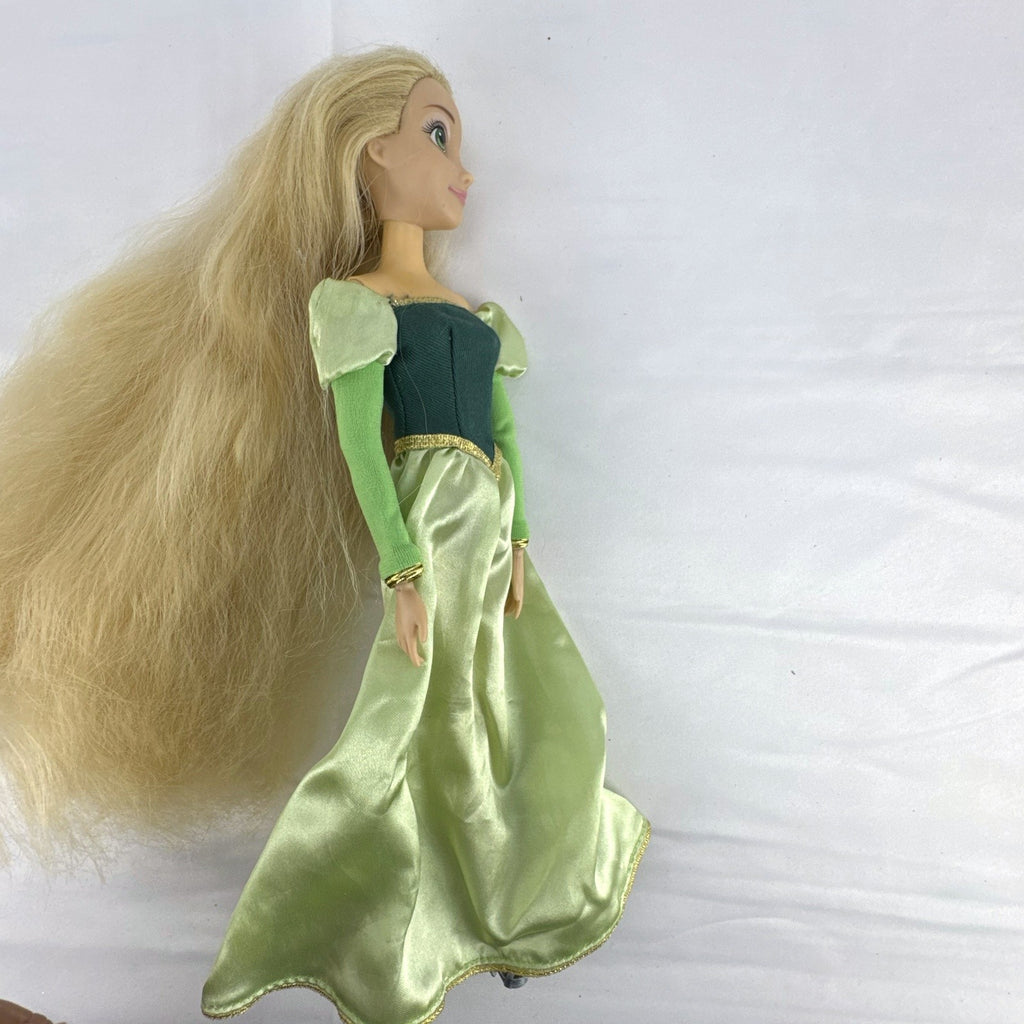 Disney Princess Rapunzel 12-inch fashion doll wearing a two-tone green gown with gold trim and grey shoes.