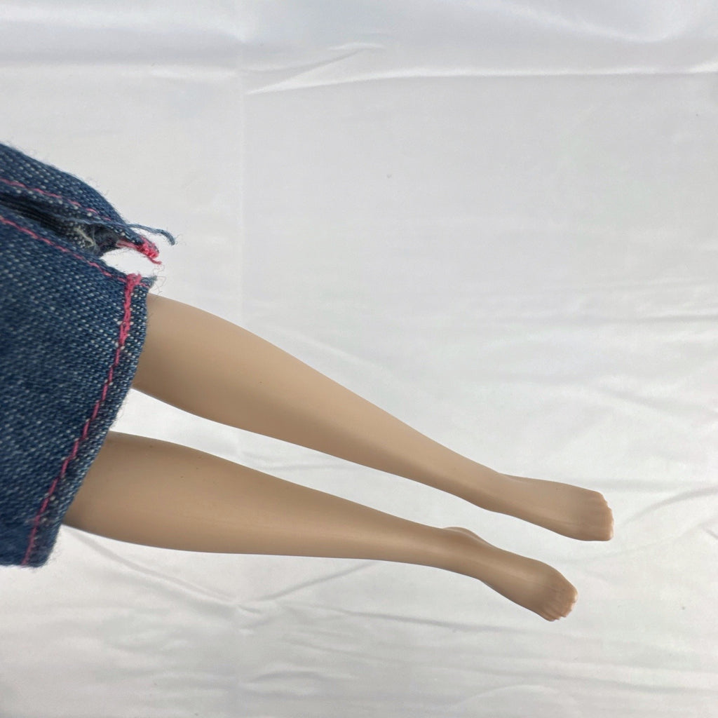 Mattel Disney Frozen 11-inch Princess Anna doll with red hair, molded bodice, and denim skirt.