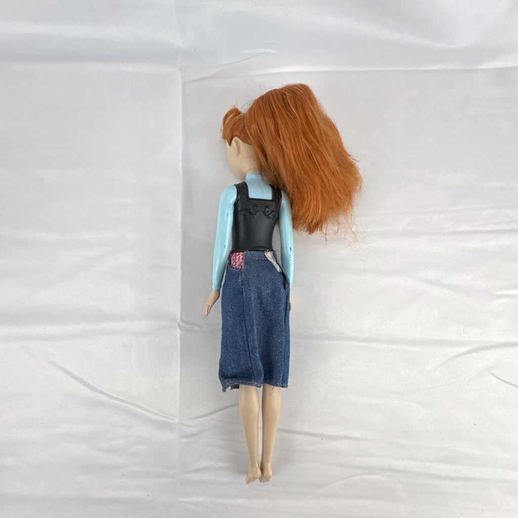 Mattel Disney Frozen 11-inch Princess Anna doll with red hair, molded bodice, and denim skirt.
