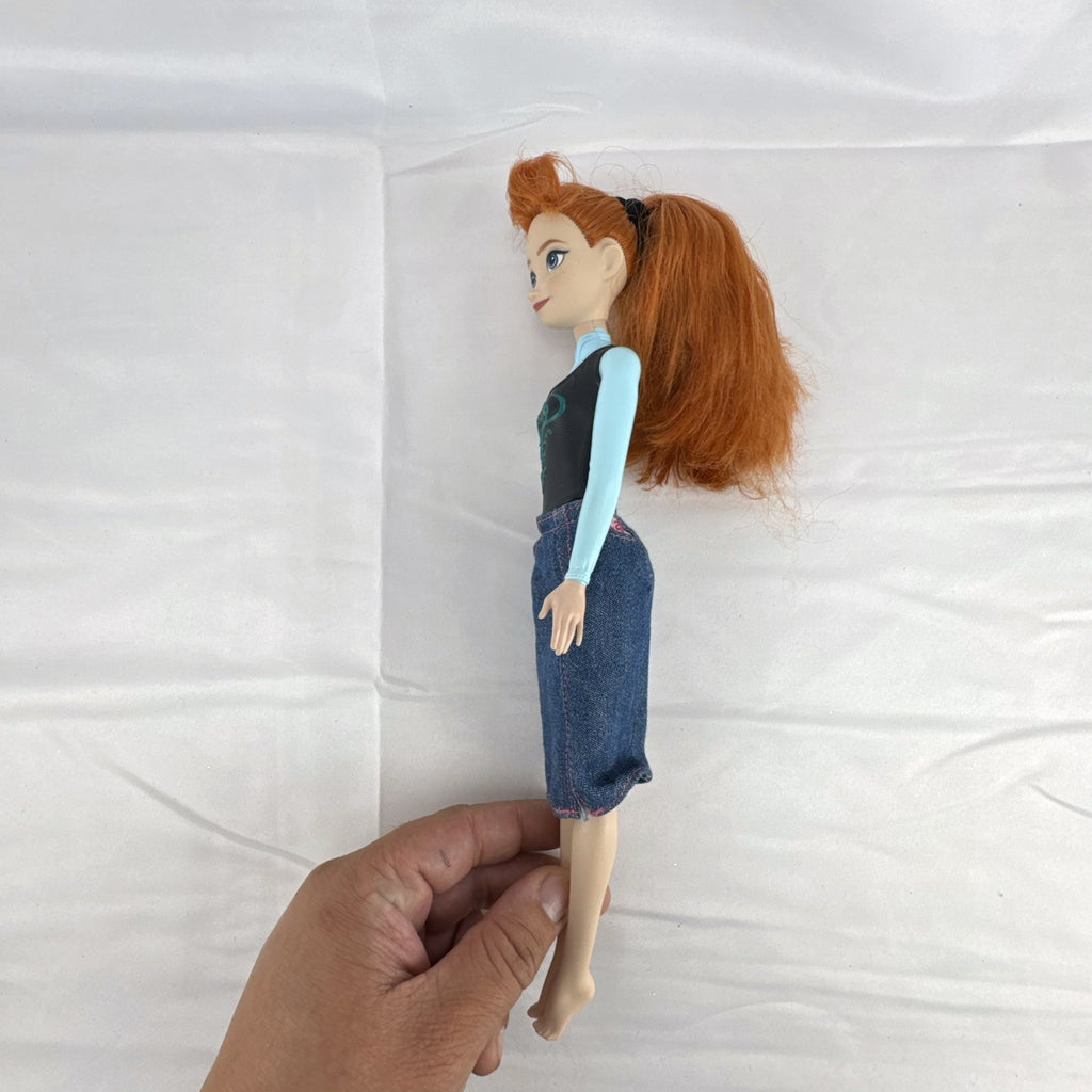 Mattel Disney Frozen 11-inch Princess Anna doll with red hair, molded bodice, and denim skirt.