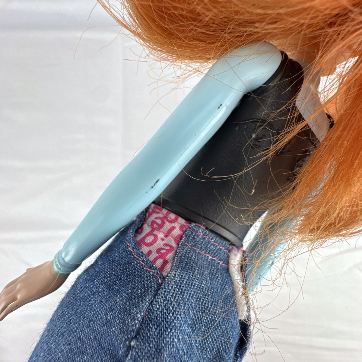 Mattel Disney Frozen 11-inch Princess Anna doll with red hair, molded bodice, and denim skirt.