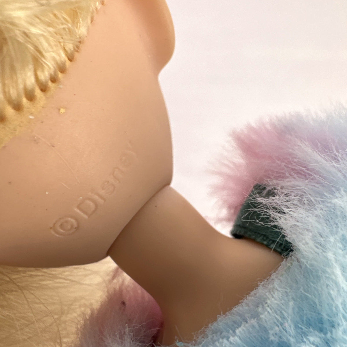 Disney Tangled Rapunzel 11-inch fashion doll wearing blue star dress and pastel faux fur jacket