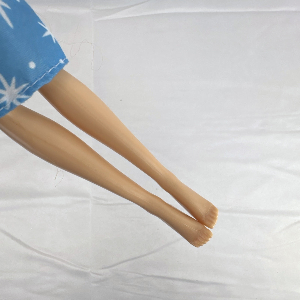 Disney Tangled Rapunzel 11-inch fashion doll wearing blue star dress and pastel faux fur jacket