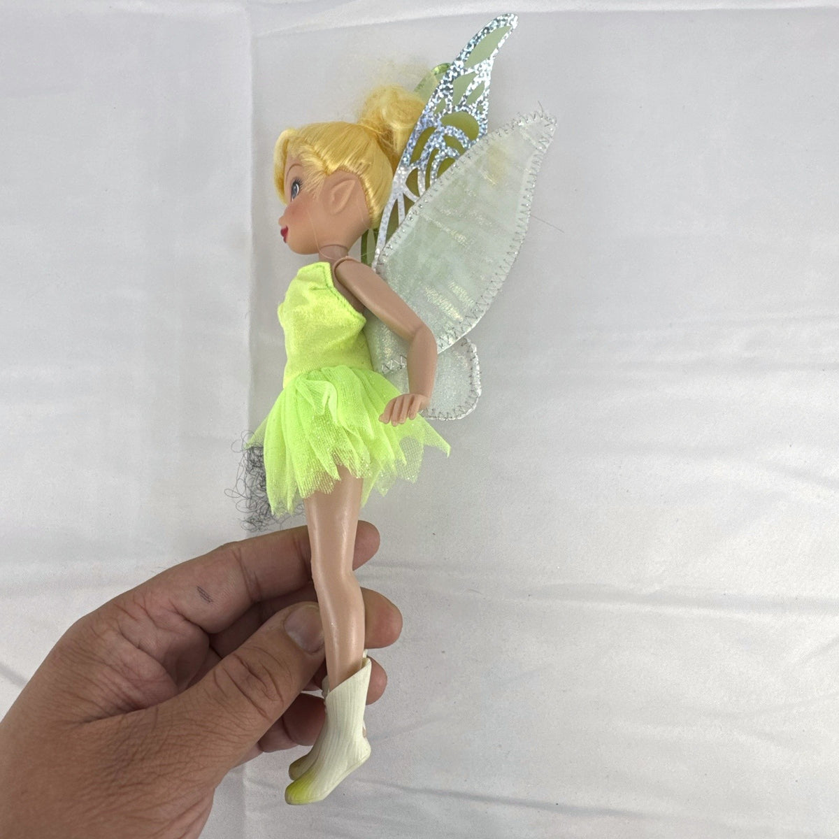 Disney Store 9-inch Tinker Bell doll in green dress with iridescent fairy wings