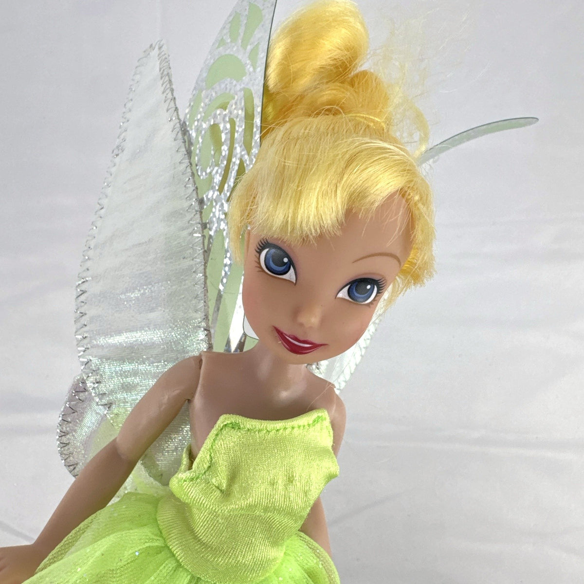 Disney Store 9-inch Tinker Bell doll in green dress with iridescent fairy wings