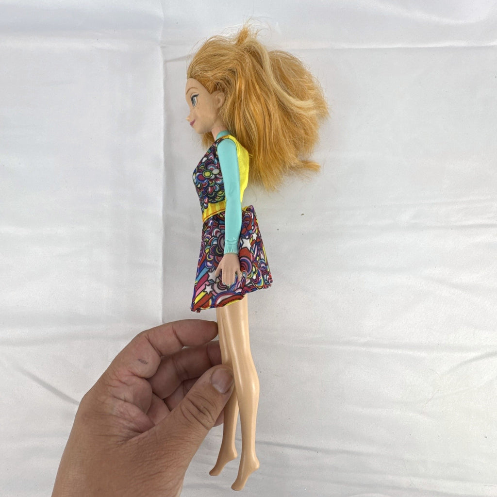 Mattel 11.5-inch Disney Frozen Princess Anna fashion doll wearing patterned dress with strawberry-blonde hair