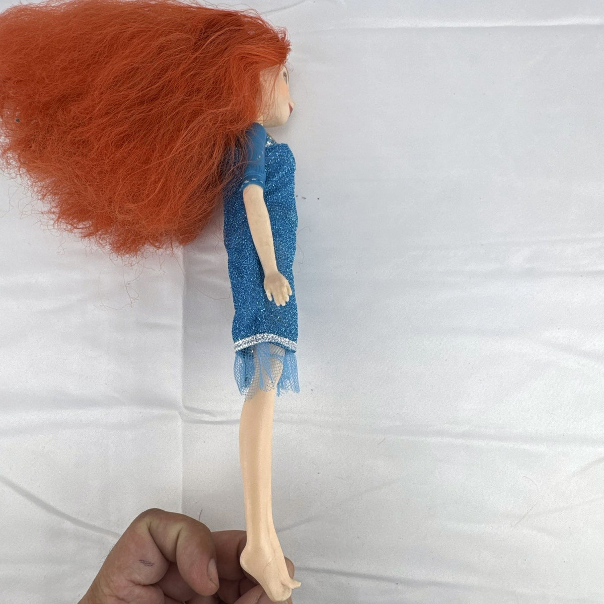 Mattel Disney Pixar Brave Merida 11-inch fashion doll with curly red hair and blue glitter dress