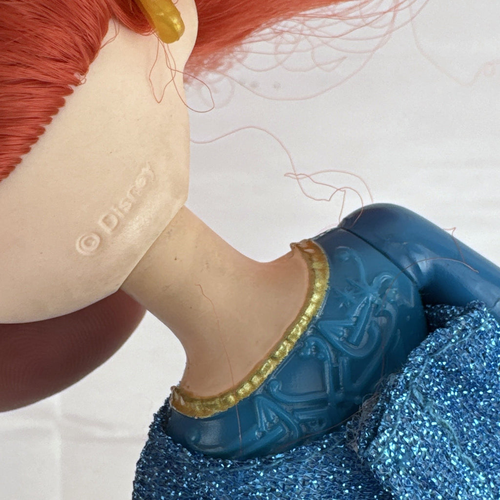 Mattel Disney Pixar Brave Merida 11-inch fashion doll with curly red hair and blue glitter dress