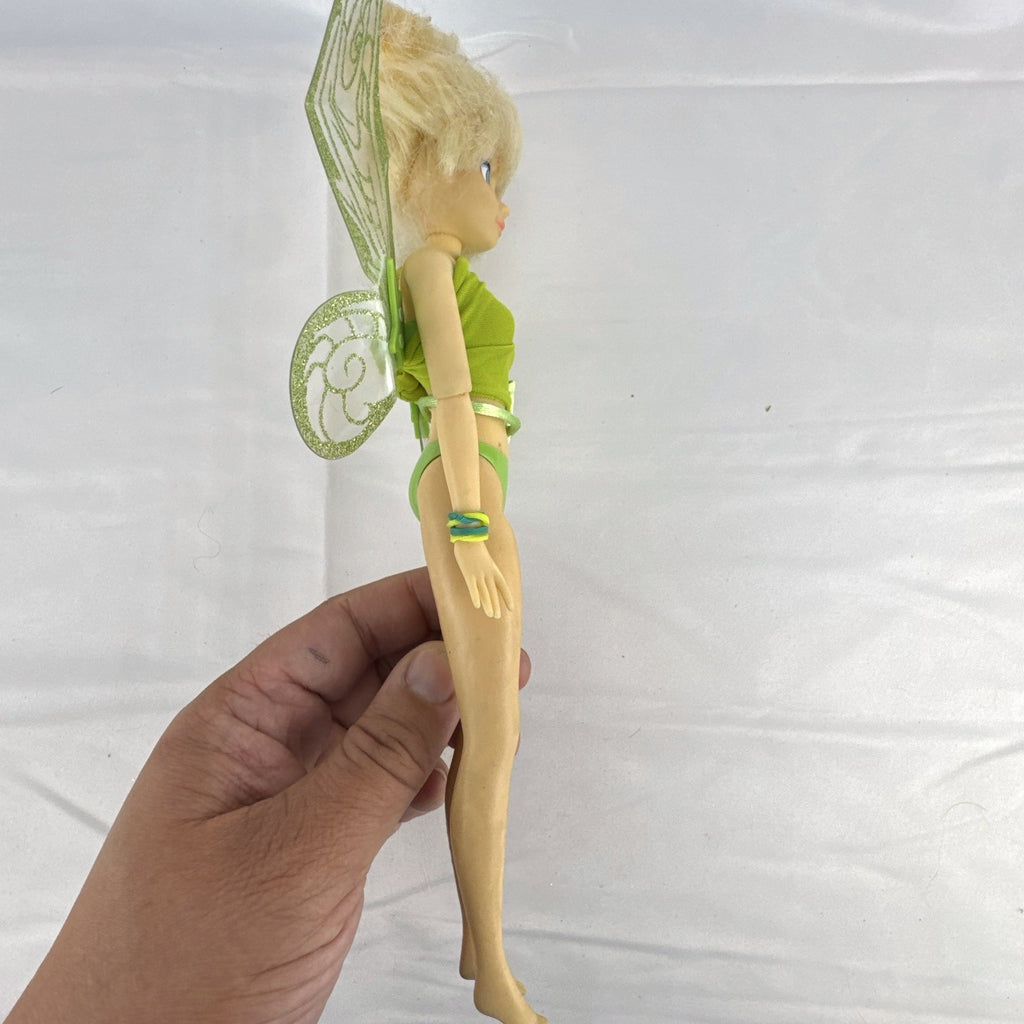 Disney Fairies Tinker Bell 9-inch articulated fashion doll with translucent glitter wings.