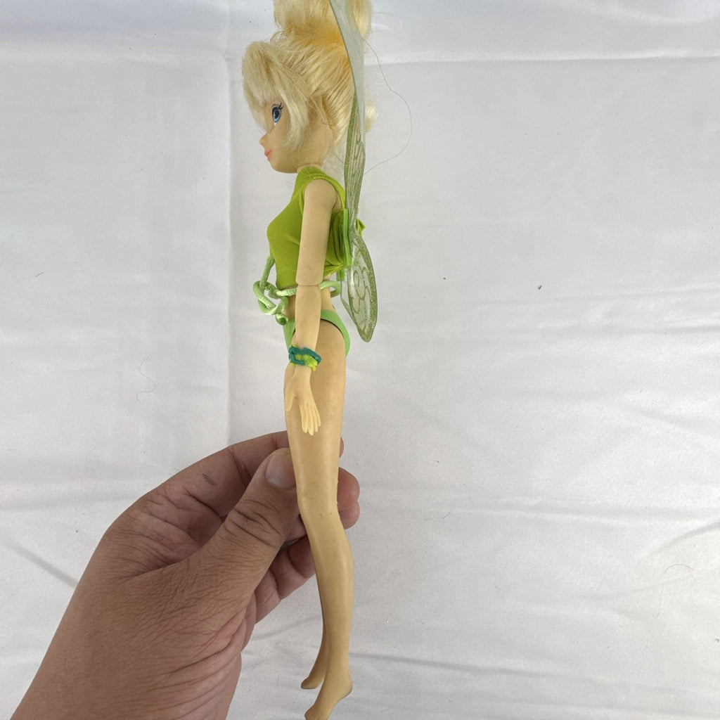 Disney Fairies Tinker Bell 9-inch articulated fashion doll with translucent glitter wings.