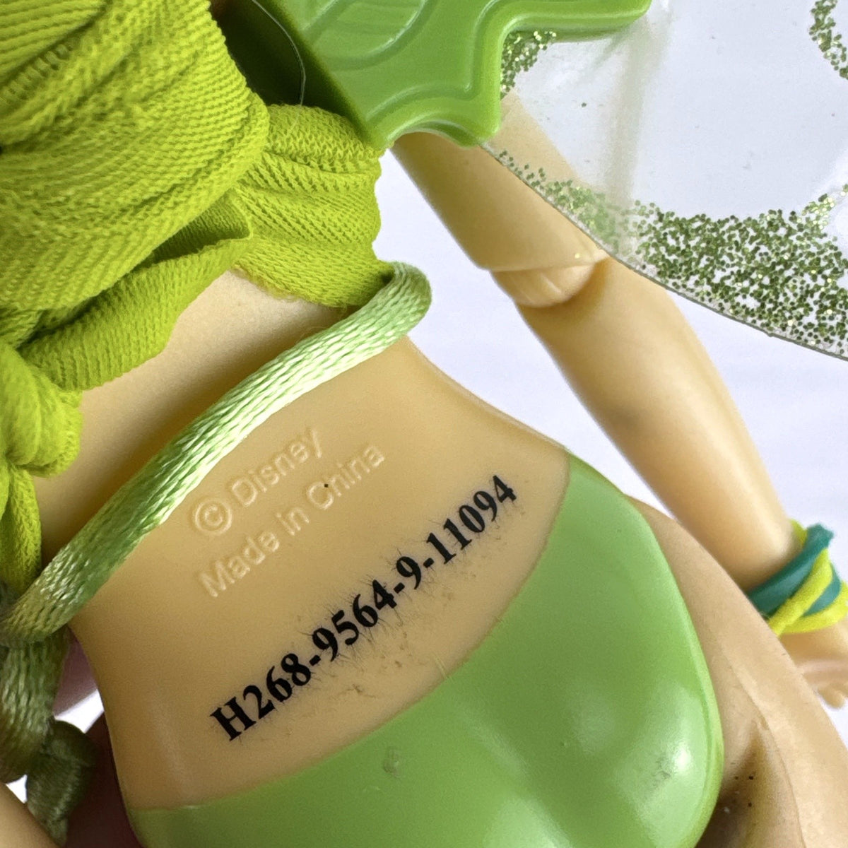 Disney Fairies Tinker Bell 9-inch articulated fashion doll with translucent glitter wings.